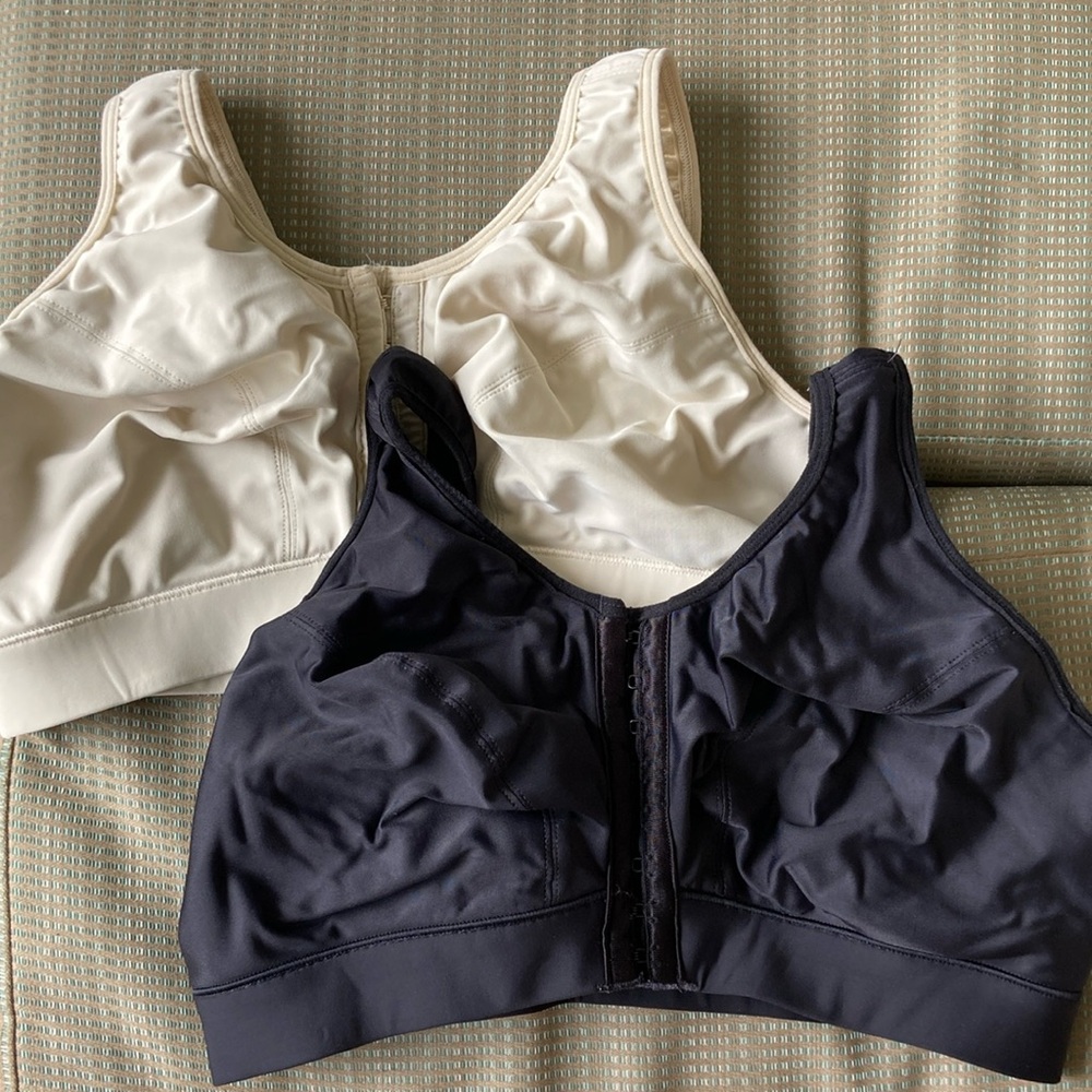 Two Enell Lite sport bras, size 2, black and ecru